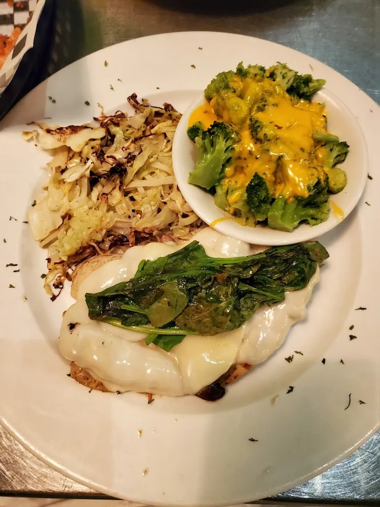 Smothered Chicken with Peppers Onions and Provolone Cheese and Broccoli and Cheese